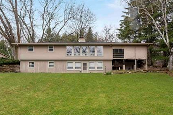 Ranch exterior back before remodeling.